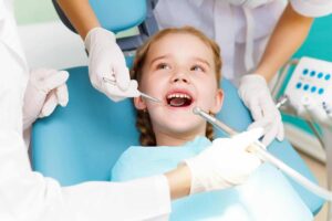 Kid in dentist chair - Spokane Family Dental